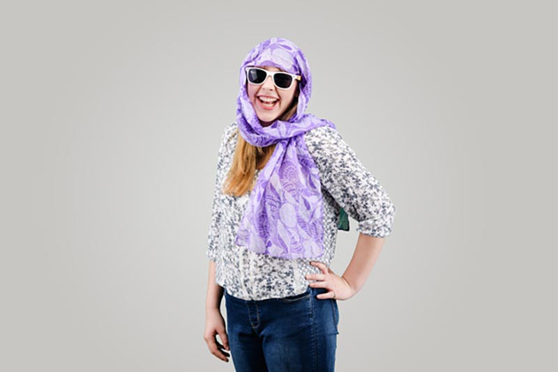 smiling girl with scarf and sunglasses