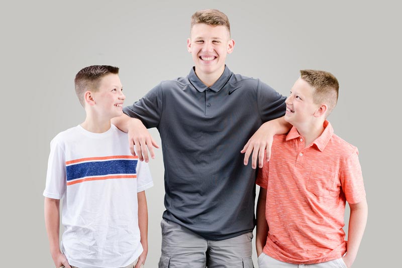 3 brothers smilling